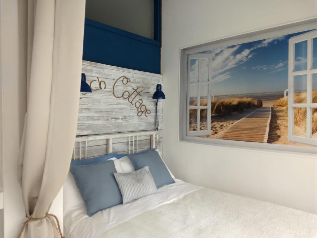 Ein Bett oder Betten in einem Zimmer der Unterkunft "Beach Cottage" monolocale vicino alla spiaggia