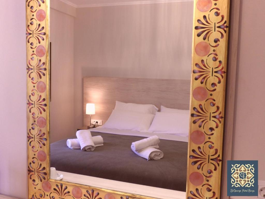 Postel nebo postele na pokoji v ubytování Saint george Hotel Parga