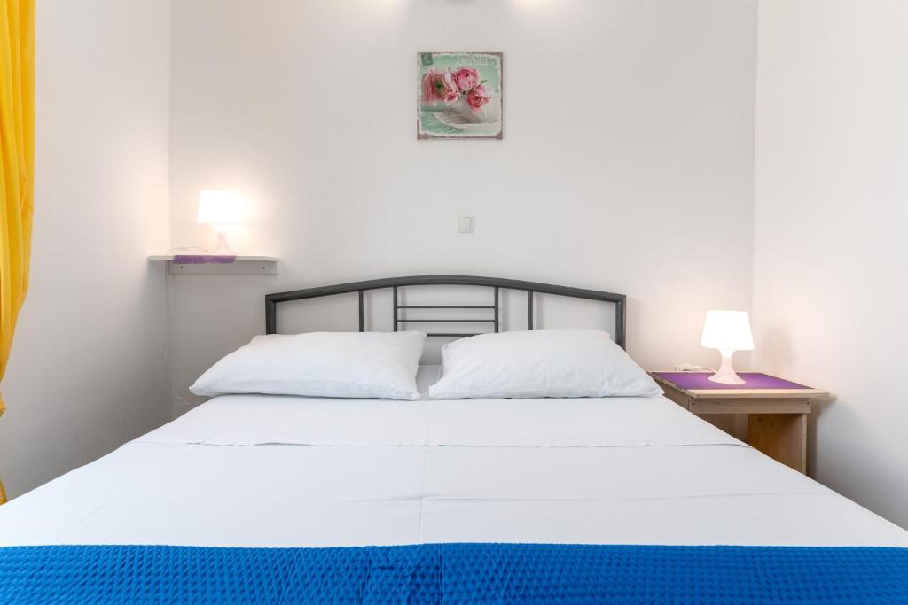 Postel nebo postele na pokoji v ubytování Apartmani RUBESSA