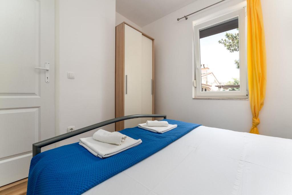 Postel nebo postele na pokoji v ubytování Apartmani RUBESSA