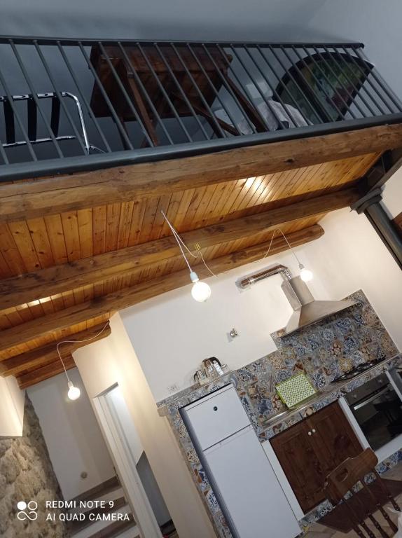 an overhead view of a kitchen with a wooden ceiling at Casa Angelene in Vitorchiano