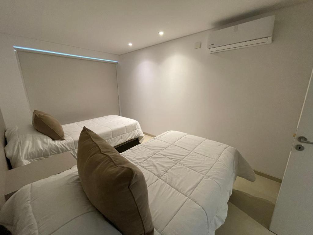 Llit o llits en una habitació de ROCAS DEL PLATA (Mendoza Capital)