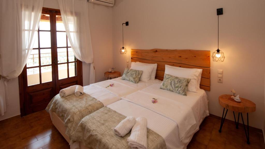 Postel nebo postele na pokoji v ubytování Giorgos apartments