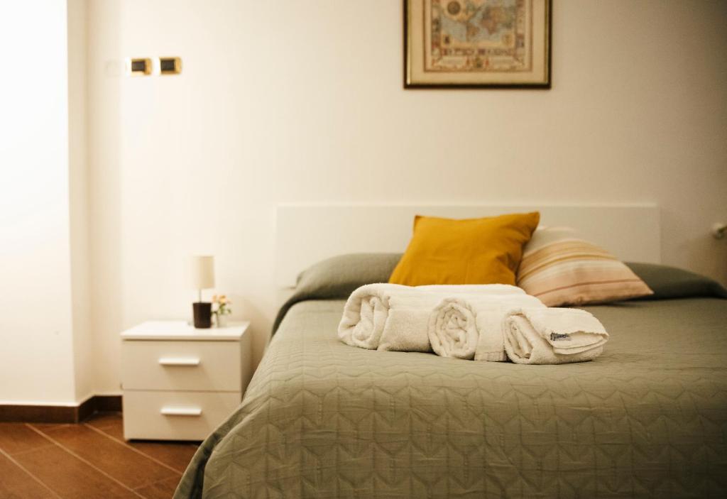 A bed or beds in a room at Palazzo de Brado