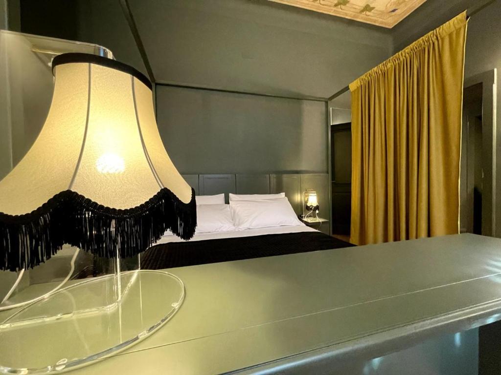 Cama ou camas em um quarto em Villa Raffaello Park Hotel