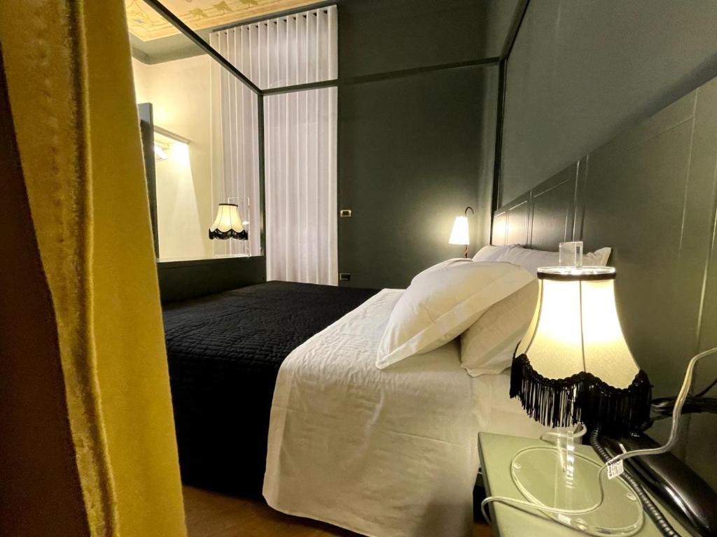 Cama ou camas em um quarto em Villa Raffaello Park Hotel