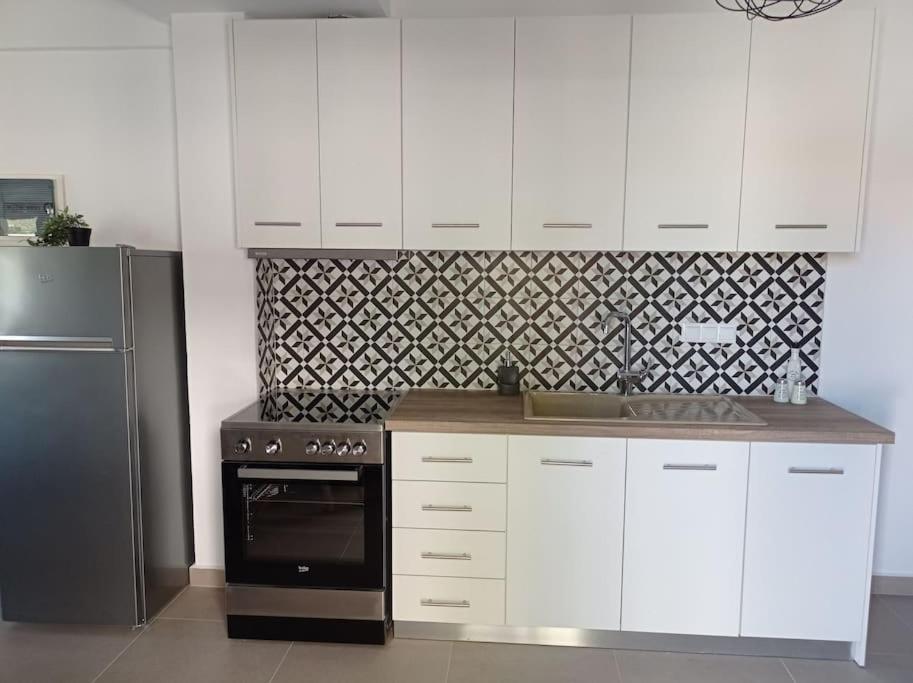 Kuchyň nebo kuchyňský kout v ubytování Melograno Apartment