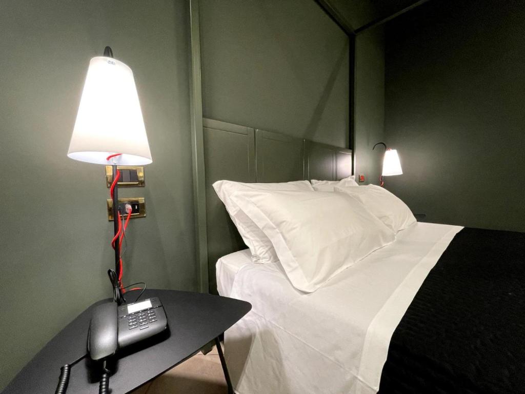 Cama ou camas em um quarto em Villa Raffaello Park Hotel