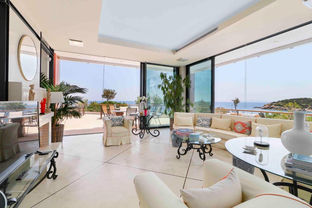 A seating area at Black Diamond Beachfront Pool Villa Pasithea in Sounio, Athens