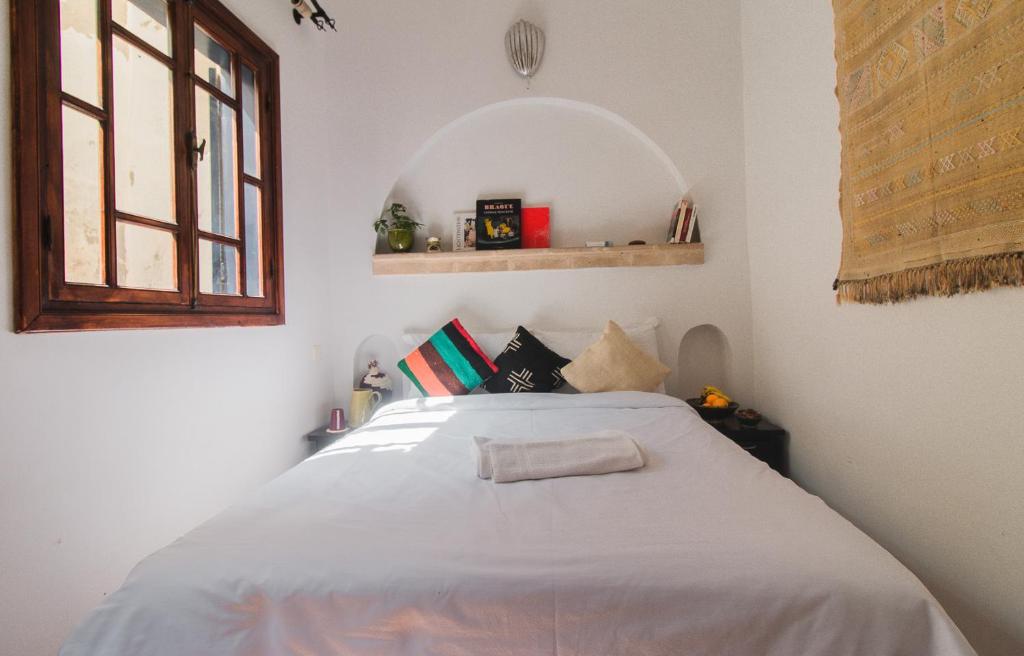 Postel nebo postele na pokoji v ubytování Noqta Space Coworking Coliving Space