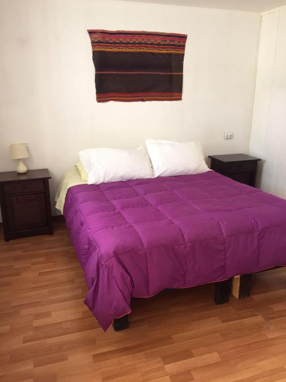 Uma cama ou camas num quarto em Hostal Siete Colores
