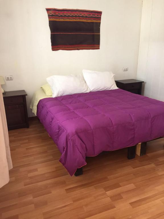 Uma cama ou camas num quarto em Hostal Siete Colores