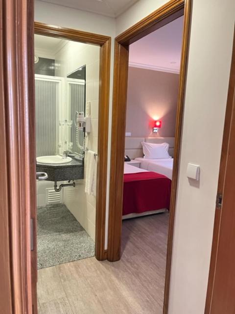 Postel nebo postele na pokoji v ubytování Seculo Hotel