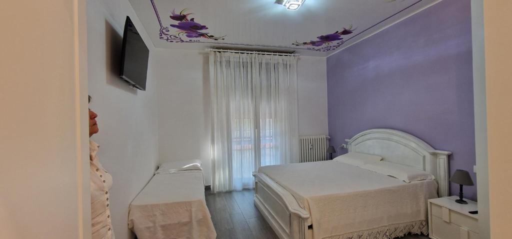 Posteľ alebo postele v izbe v ubytovaní Orchidea