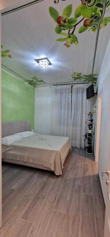 Posteľ alebo postele v izbe v ubytovaní Orchidea
