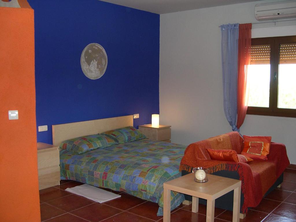 A bed or beds in a room at La Venta de las Estrellas Casas Rurales