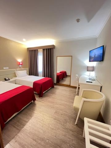 Postel nebo postele na pokoji v ubytování Seculo Hotel