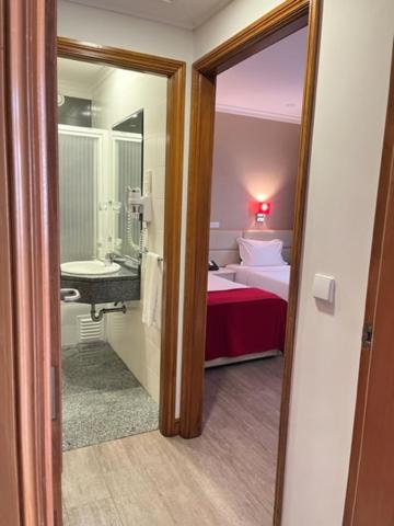 Postel nebo postele na pokoji v ubytování Seculo Hotel