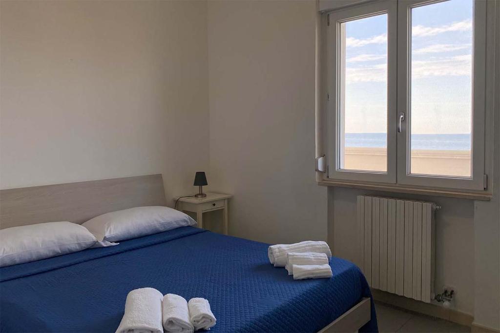 A bed or beds in a room at BlueBay Residence Resort