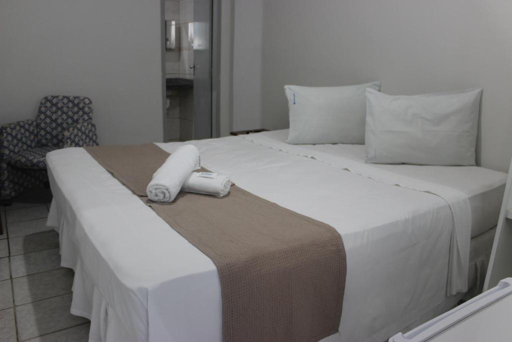 Cama ou camas em um quarto em Pousada Cecosne