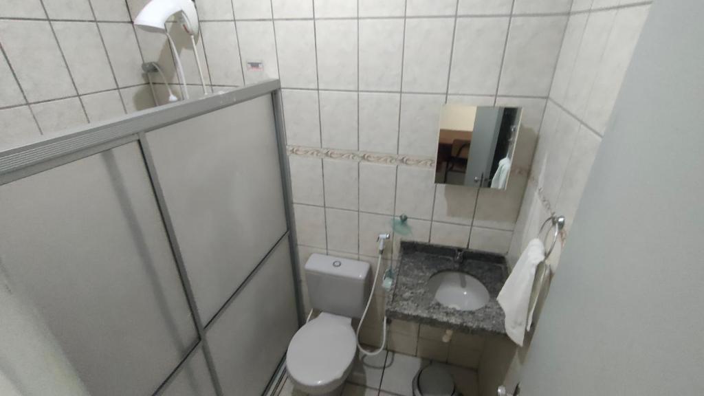 Um banheiro em Pousada Cecosne
