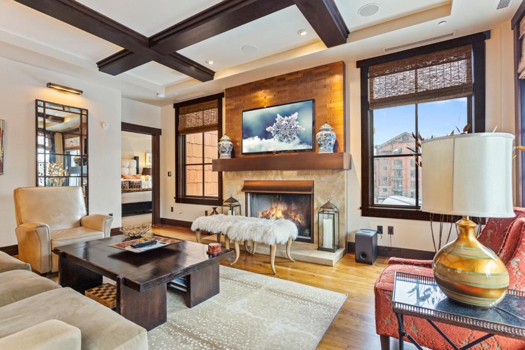 a living room with a fireplace and a couch at Flagstaff #202 in Park City