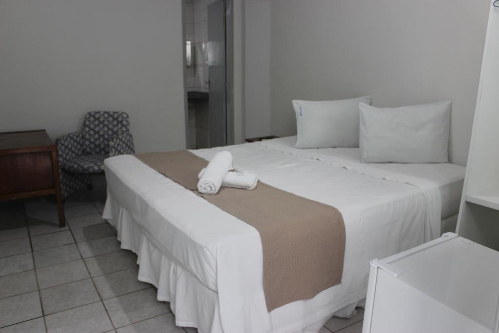 Cama ou camas em um quarto em Pousada Cecosne