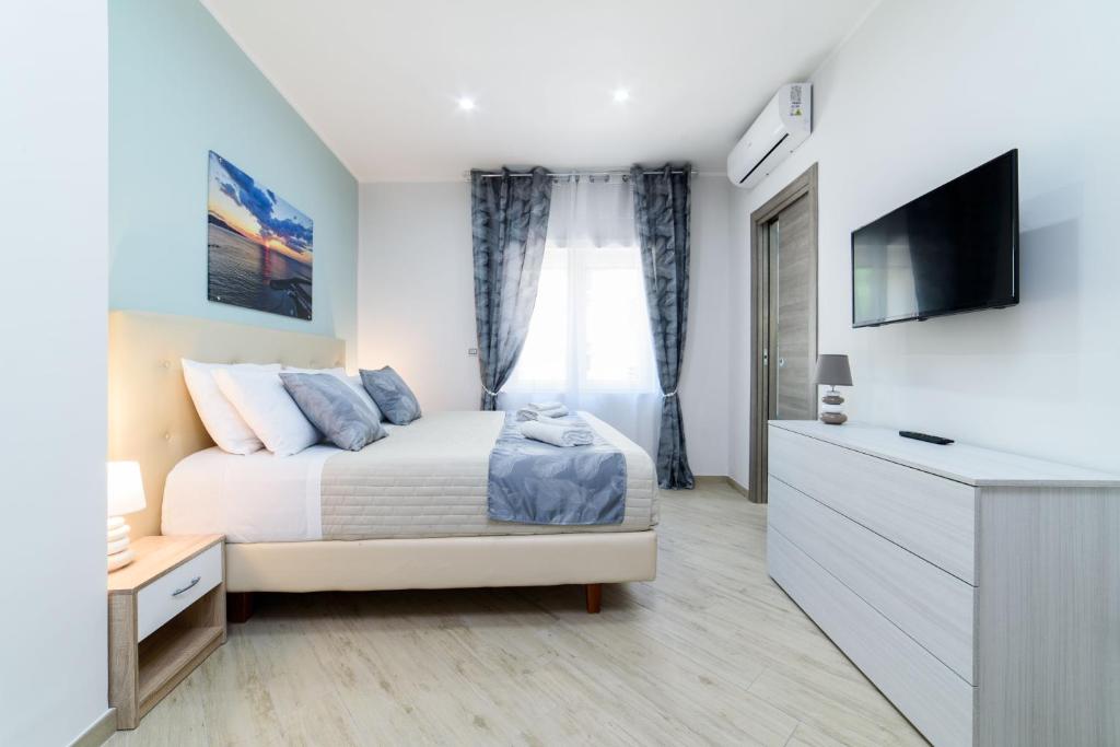 Postel nebo postele na pokoji v ubytování SYMPHONY HOUSE