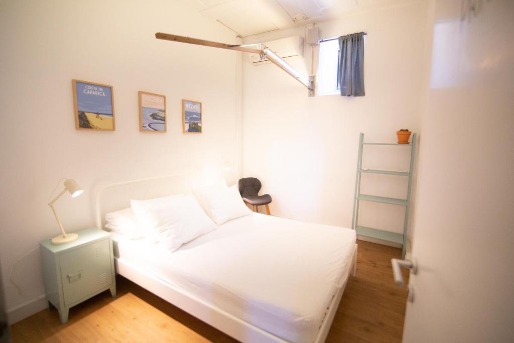 Postel nebo postele na pokoji v ubytování LX Hostel