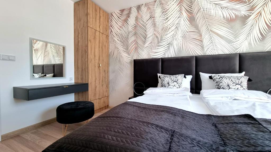 Posteľ alebo postele v izbe v ubytovaní NOOK NOOK Apartments Bytkowska 103