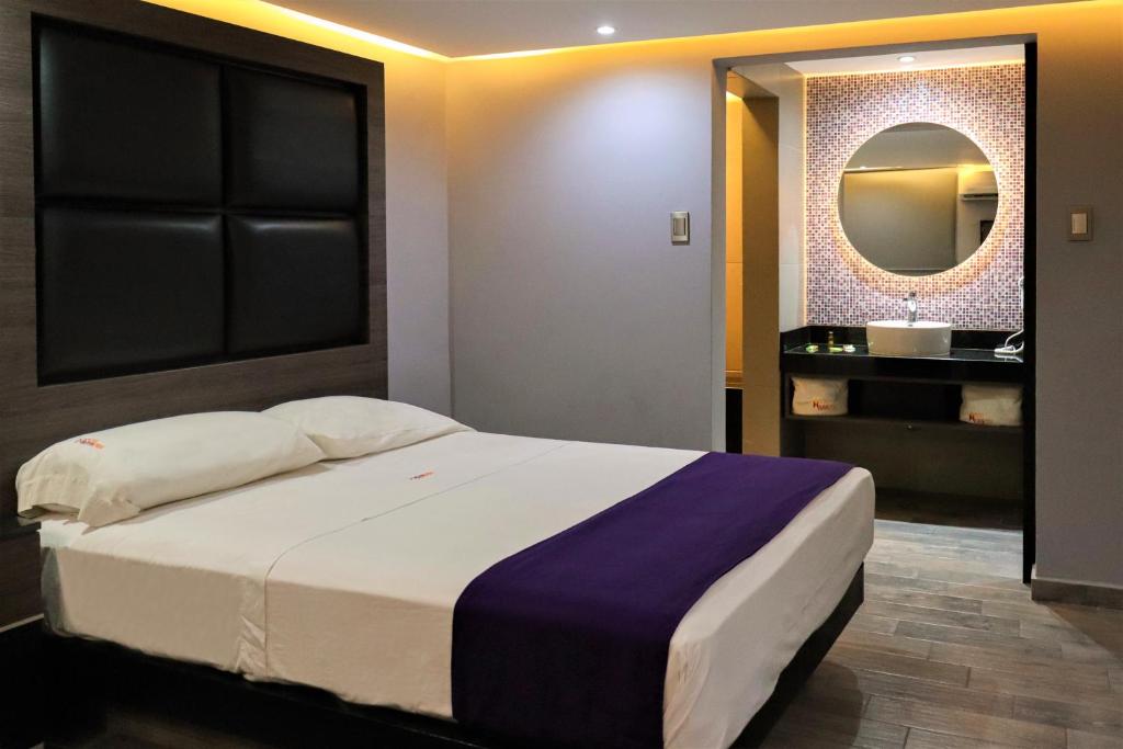 Postel nebo postele na pokoji v ubytování Auto-Hotel Playa Linda