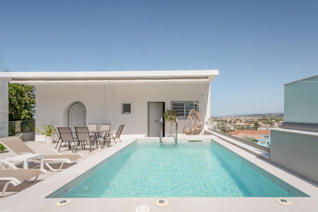 a swimming pool on the roof of a house at Onirion Homes : Stella's Home in Kolymvari