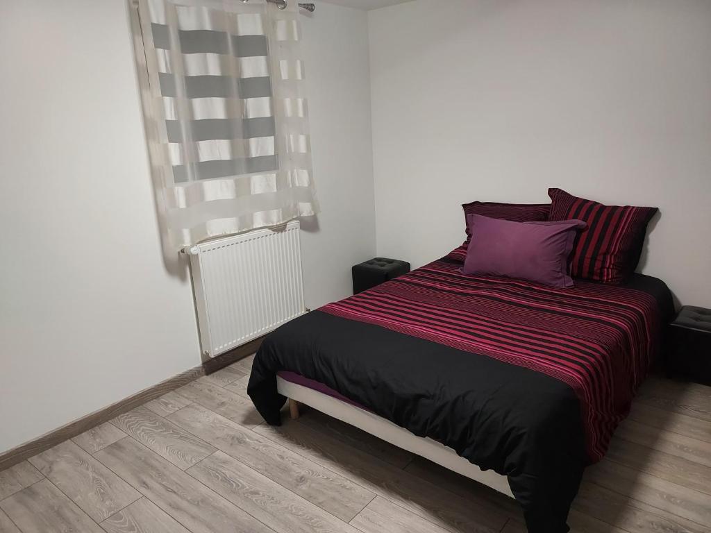 Katil atau katil-katil dalam bilik di Appartement bleu