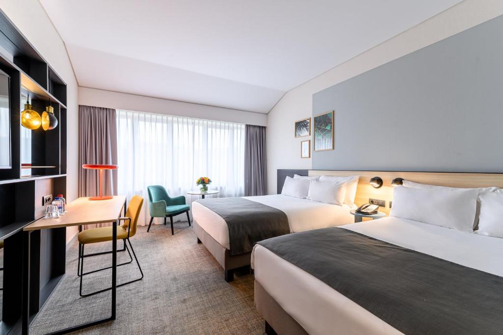 Postel nebo postele na pokoji v ubytování Holiday Inn Hasselt by IHG