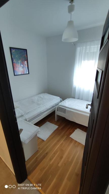 Postel nebo postele na pokoji v ubytování Apartmani Gavran