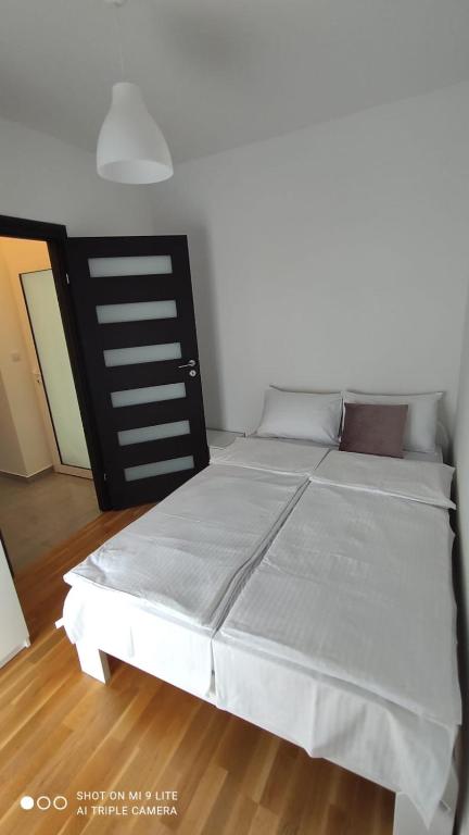 Postel nebo postele na pokoji v ubytování Apartmani Gavran