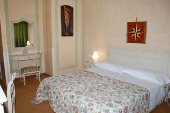 Postel nebo postele na pokoji v ubytování Hotel Il Burchiello