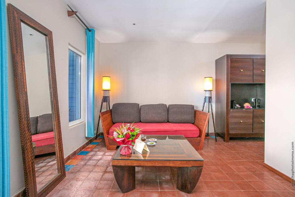 Posezení v ubytování Les Villas du Lagon