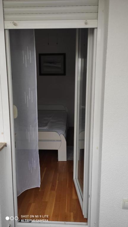Postel nebo postele na pokoji v ubytování Apartmani Gavran