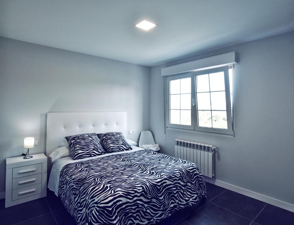 Posteľ alebo postele v izbe v ubytovaní Apartamento Las Perdices II