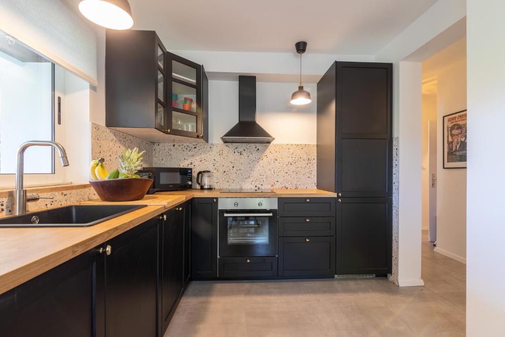Kuchyň nebo kuchyňský kout v ubytování Villa Pinus