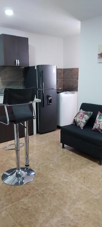 Kuchyň nebo kuchyňský kout v ubytování Cómodo apartaestudio con excelente ubicación