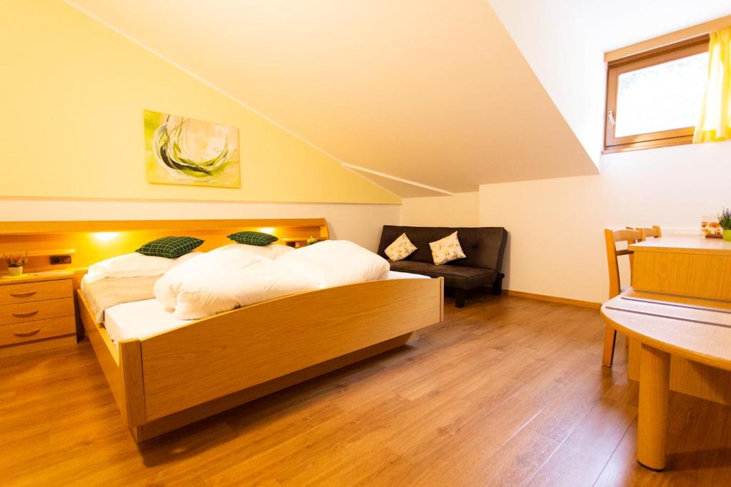 Postel nebo postele na pokoji v ubytování Almhotel Bergerhof