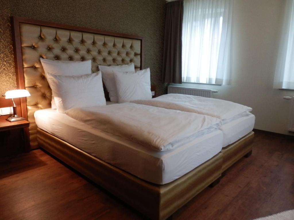 Postel nebo postele na pokoji v ubytování Hotel Paul Otto