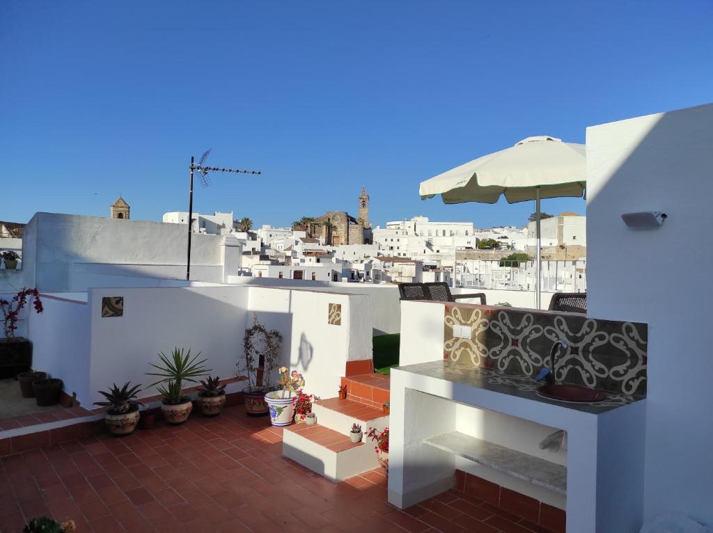 a balcony with a view of a city at ISAMAR Apartamentos in Vejer de la Frontera