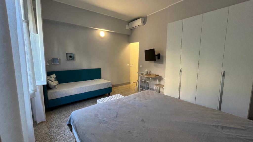 Postel nebo postele na pokoji v ubytování Bed and coffee Rooms Portoferraio