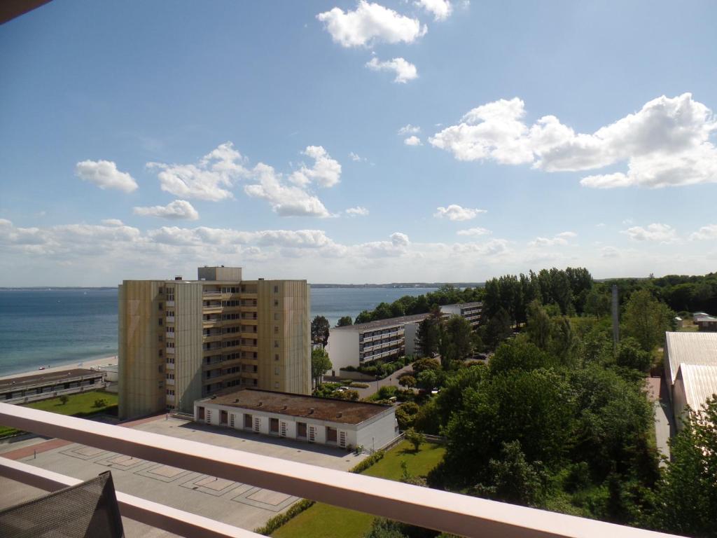 a view of the ocean from the balcony of a building at Ferienpark Sierksdorf App 773 - Strandlage in Sierksdorf