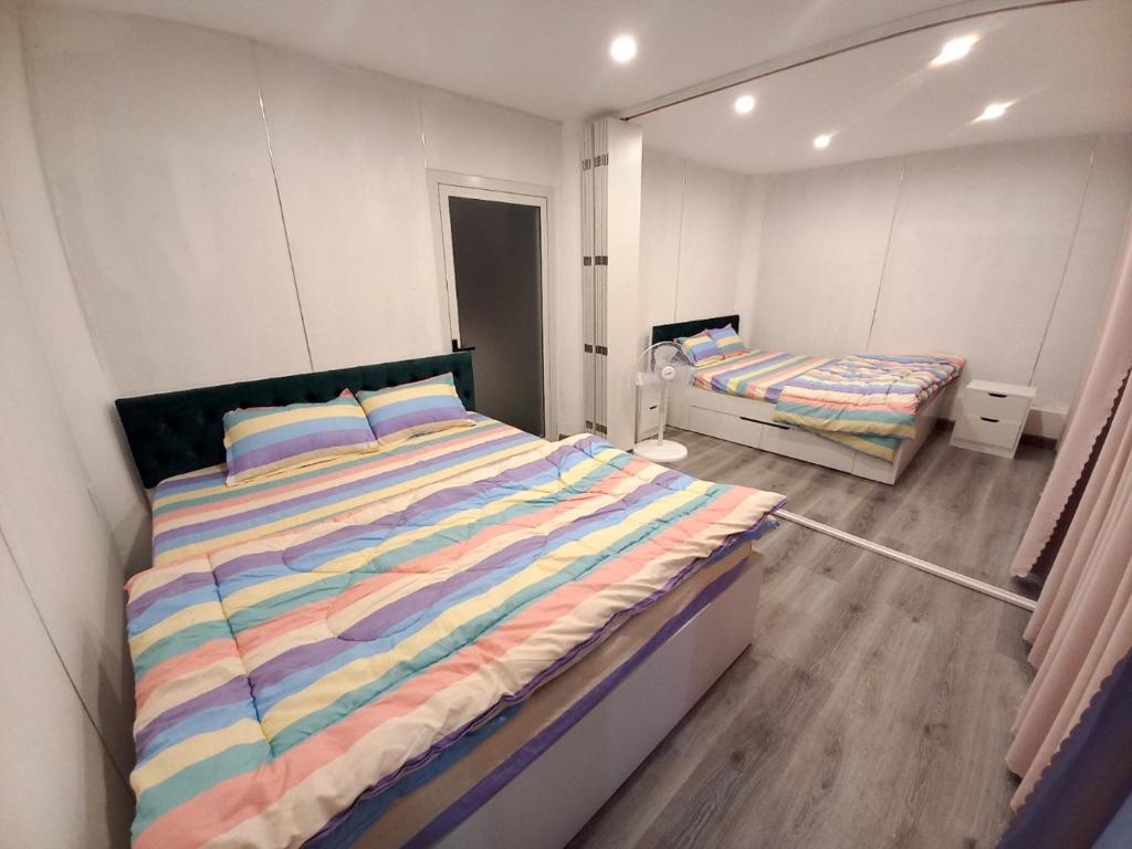 Postel nebo postele na pokoji v ubytování Dong Thanh Ecolodge Homestay
