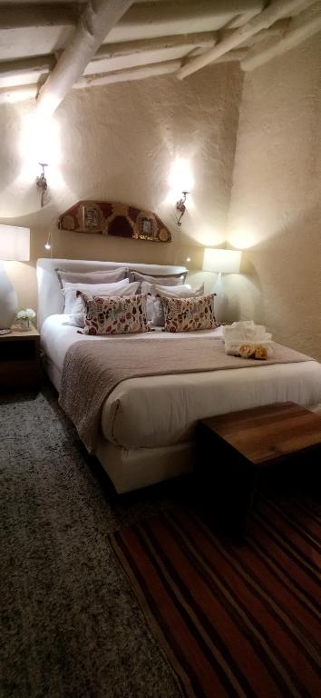 Postel nebo postele na pokoji v ubytování Candelaria House Boutique