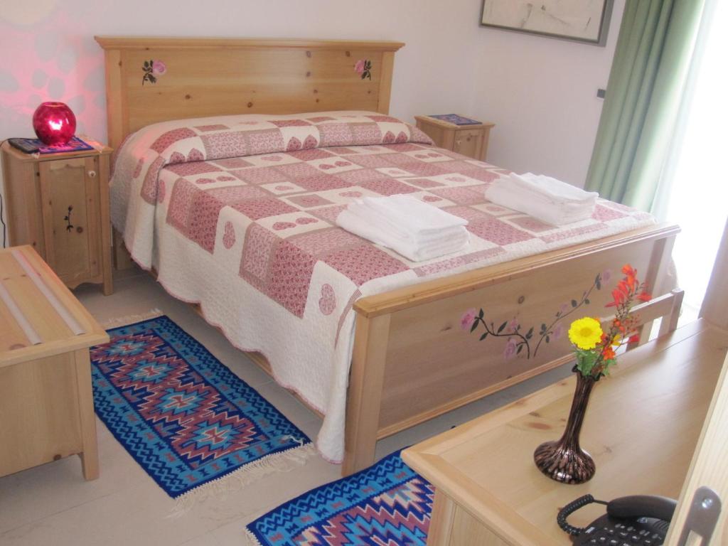 Posteľ alebo postele v izbe v ubytovaní R&B La Gerla Blu